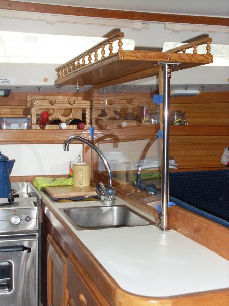 Galley shelf and wine rack (background)