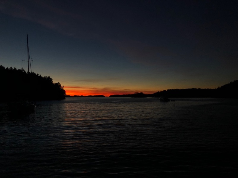 A sunset over a body of water  Description automatically generated