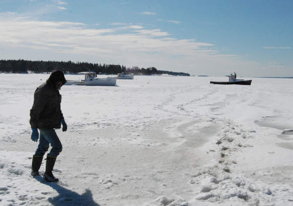 Fisherman walking on ice.jpg
