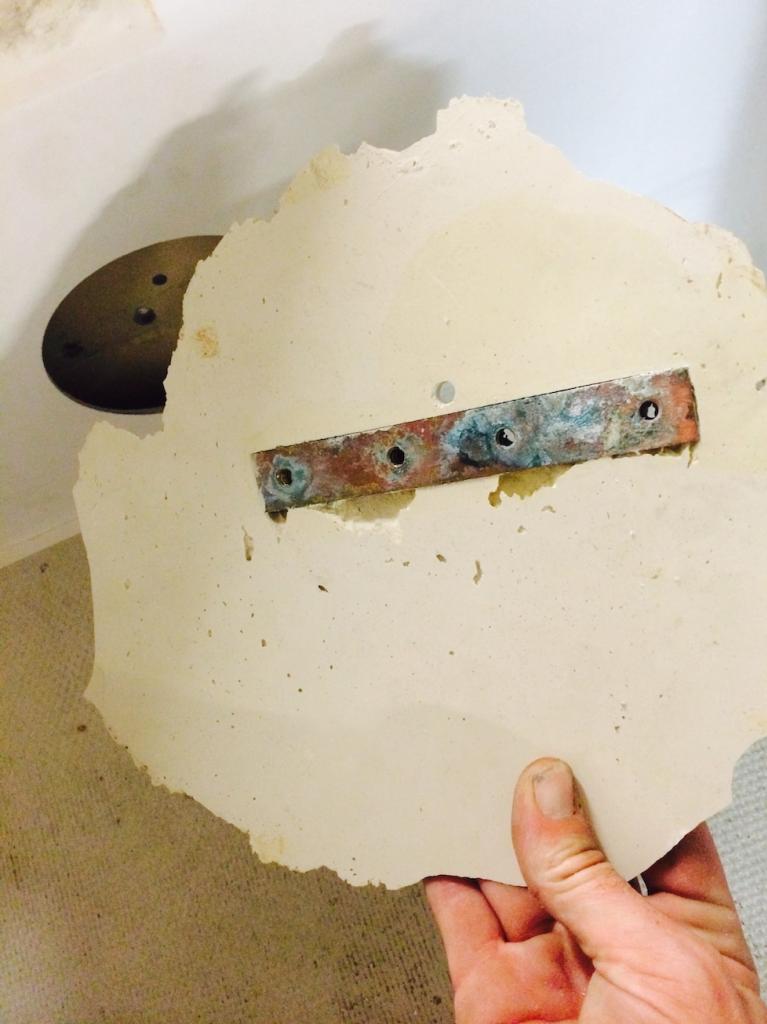 Transom factory bronze Insert in putty.jpg