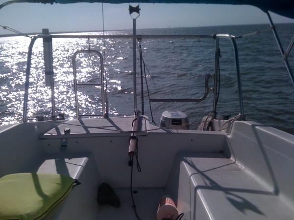 1st generation poor mans autopilot.
 A piece of tubing welded to a screw, sticks in a hole in the tiller. Run a rope from one side of the boat, through the tubing, to the other side. Pull it tight, and it holds the tiller where you leave it, but you can still steer.