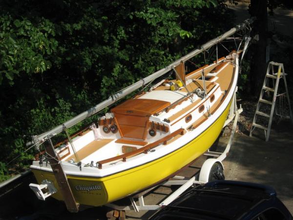 2006 Paint Job -- taken from my bedroom window.  &quot;John Deere Yellow&quot; two-part polyurethane on hull, white two-part polyurethane on deck, tan Durabak non-skid