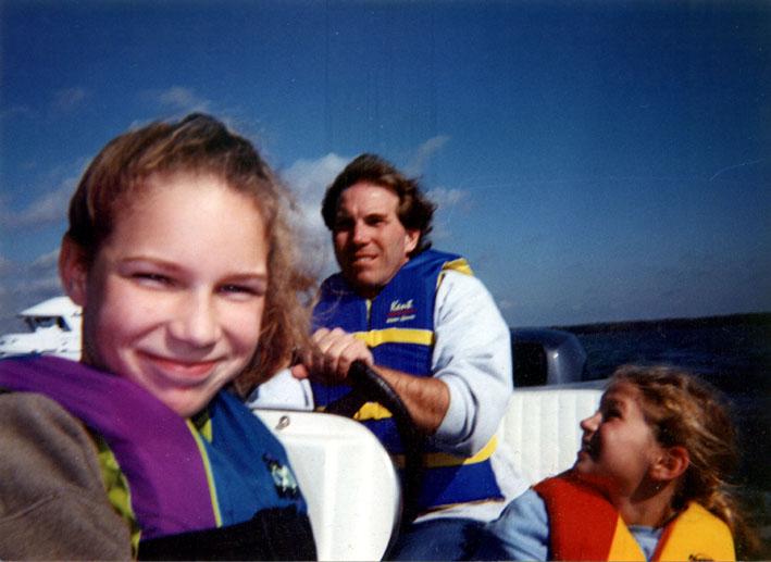 28 October 2002.  Lovely day spent with friends on the C&amp;D Canal.  At Elk River we stopped and I drove the kids over to a camp using the inflatable.  First time driving an outboard skiff in about 35 years!  This is Mary (L) and Rachel (R).