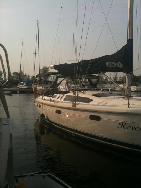 A calm summers eve in northern Lake Champlain. She's a '97 H376 and likes to be sailed!