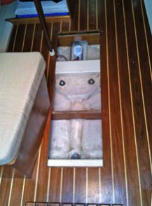 Access cover removed.  Notice the two athwart ship floor joists that have been added.  These provide better support for cabin sole and the bilge access cover.  (Also, notice the bottom of the forward joist has been cut away to allow better access to the bilge pump.)