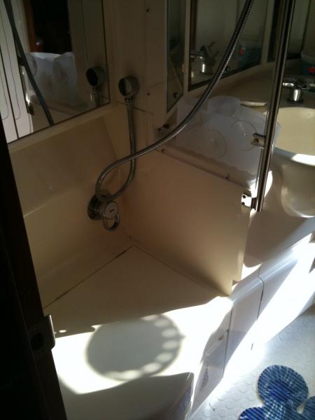 Aft head - the &quot;challenge&quot;! My last boat had a separate shower stall / tub - this one has a small compact Jabsco manual head and a cover so you can keep things dry ...