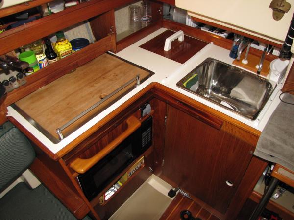 Another upgrade... a &quot;big-boat&quot; galley sink!  we upgraded to a full size sink, large enough to handle even full size plates (Woo Hoo!! ...no more hanging my a$$ over the side to do the dishes!)  So, with the salt-water foot pump and a pressurized fresh water, doing the dishes should be much easier than previous trips.