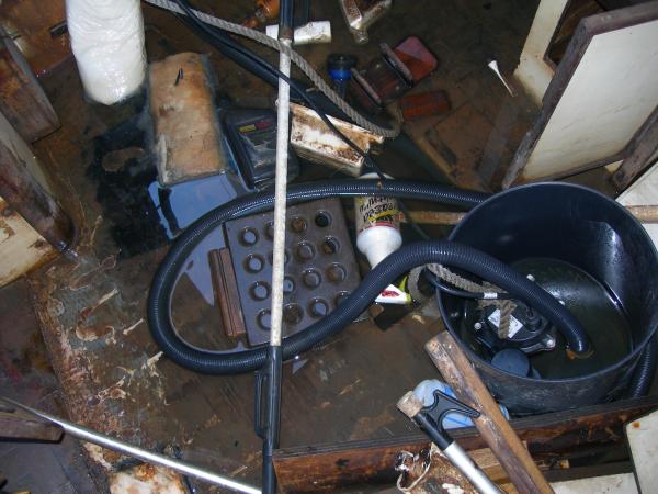 as i found her. Two feet of water inside, note the head and other junk floating around, yuck. View fro companionway looking down.