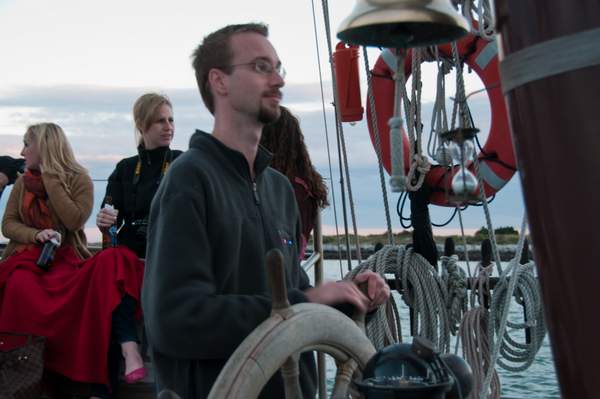 At the helm of the Schooner Freedom