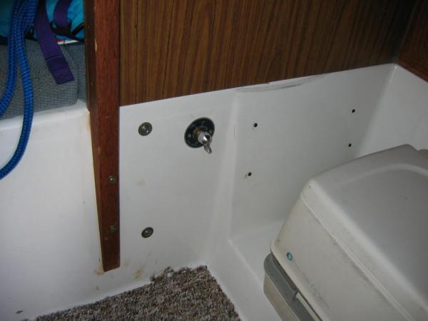 Battery switch on V-berth bulkhead.