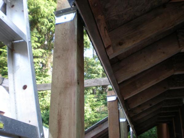 boat lift pictures. Lift under construction, one side of lift strapped to the roof of my shop. All the 4x4's are also buried 2ft in the ground.