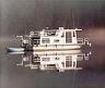 Boat Pictures 608 - Bought new in 1993 for $40,000 stripped so I could afford the payments. Spent $20,000 over 12 years giving it all the equipment needed for long range cruising. Carried 300 gallons of fuel and was 40' long upon completion.
The single volvo outdrive made it a challenge to dock and lock through single handed.