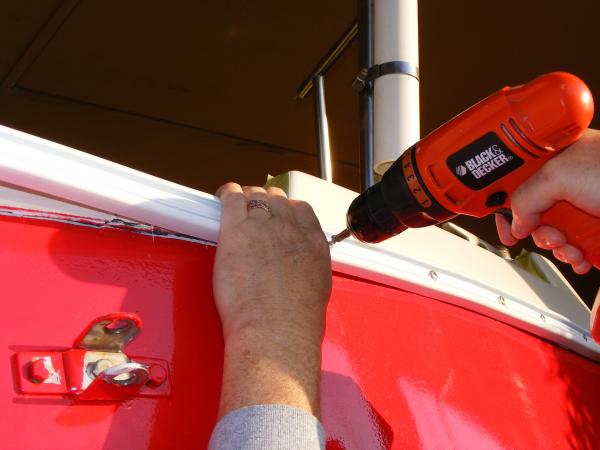 Bringing the rub rail around the corner of the stern took the most patience. I used a hair dryer to heat the rub rail and had to keep it on the corner much longer than when I heated the bow.