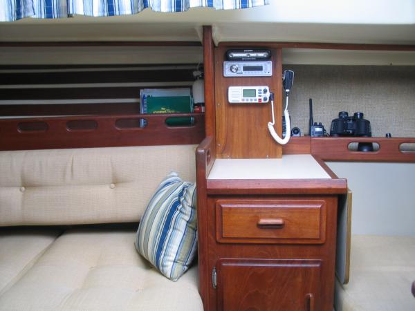 Built a area out of teak to house the VHF and Stereo.