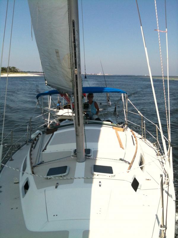 Catalina 30 with First mate at Helm