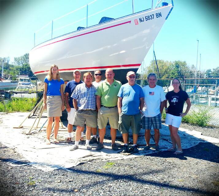 Cherubini Yachts shop-staff portrait with R33 no.15, Suzanne, when the boat was being returned to owners.  This boat was declared a total write-off when it came into the shop in November 2012.

L-to-R: Zoya, office staff; Gary, boat owner; my brother Steve, shop staff; my cousin Lee, contractor; Jeremiah, shop staff; Ziggy, shop staff; JC Jr (me), contractor; Aimee (my 2nd cousin), Raider Yachts archivist/historian and granddaughter of Joe Cherubini (RIP), boat's builder.

Aimee is wearing an original 1970s Raider Yachts t-shirt!

October 2013