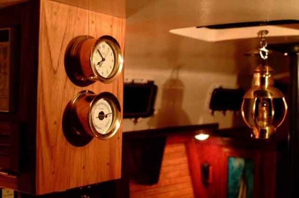 Clock and Barometer with oil lamp in background