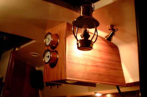 Clock and Barometer with oil lamp in foreground