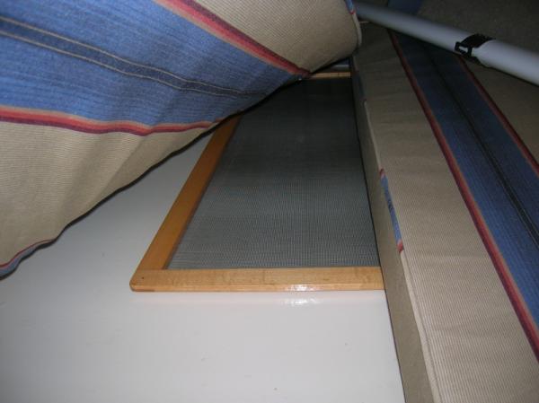 companionway screen storage under vee birth cushions