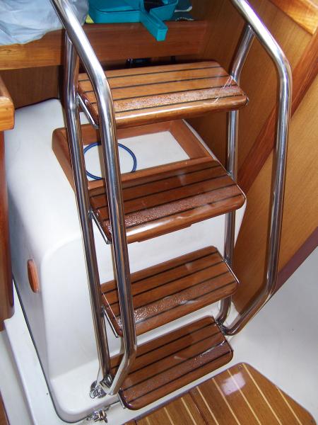 Companionway stairs with glass and System Three epoxy.  Final coating of three coats of varnish and then polished.