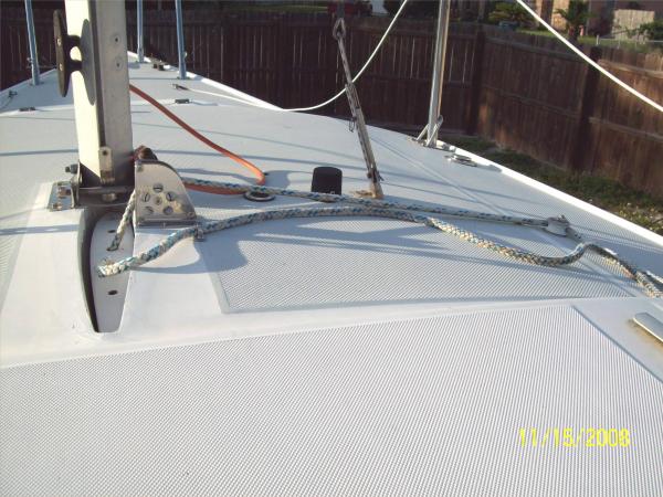 Daggerboard block to stop line cutting into deck.  To right, just before the stanchion, is filler for water tank.