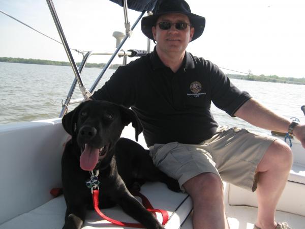 Dan and Moose on boat.