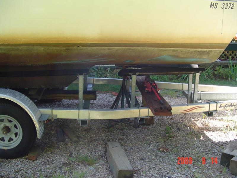 DSC01463 I'm jacking the bow of the boat from the trailer and using a straight powerboat stand to hold the height so that I can let the jack down and move the trailer ahead by hand and reset the jack again.