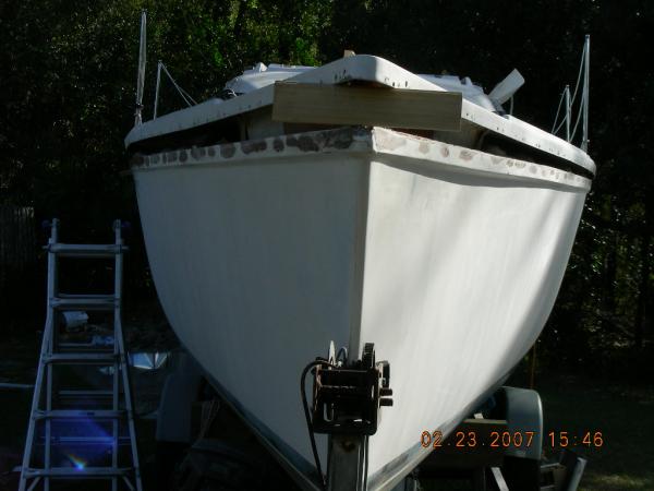 DSCN3525 Deck lifted.  The bow proved the most challenging. The pin in the anchor locker goes through the hull and deck, and is glassed over.