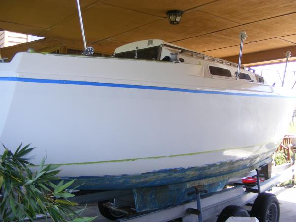 First coat of Oyster White Perfection. Above the rub rail and the water stripe (boot stripe) will be white. I was really excited about how it was looking.