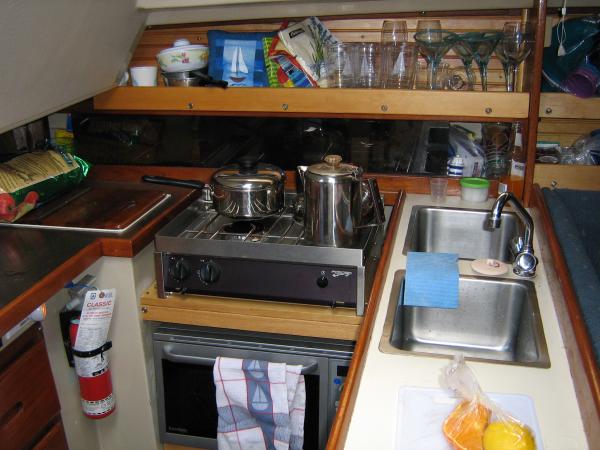 Galley, with two-burner Force Ten propane stove and combination toaster-oven/Microwave below it.