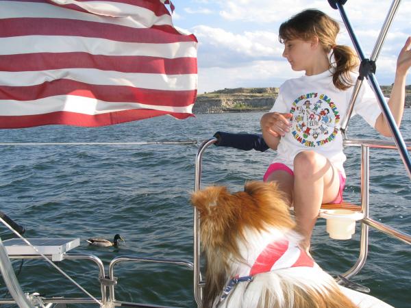 Grand daughter Hunter on our Hunter 26 with Jake and Duck.