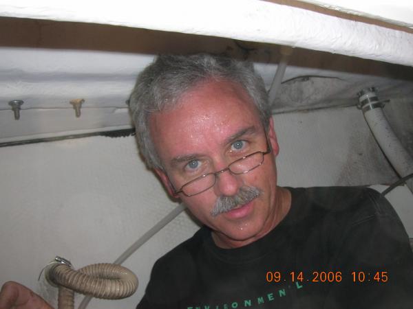 Here I am down in the starboard cockpit storage area. As the smallest partner I'm the designated tunnel rat. This is NOT the place to be during a Mississippi summer.