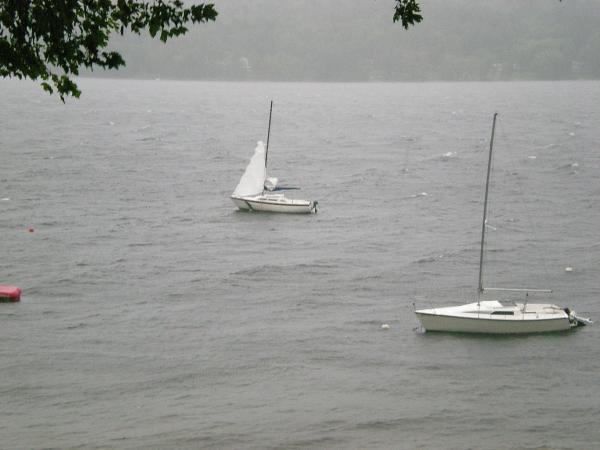 Hurricane Irene being naughty to to my neighbor's NA 23, dragging the mooring down the lake.  Should have secured the sails below, huh?