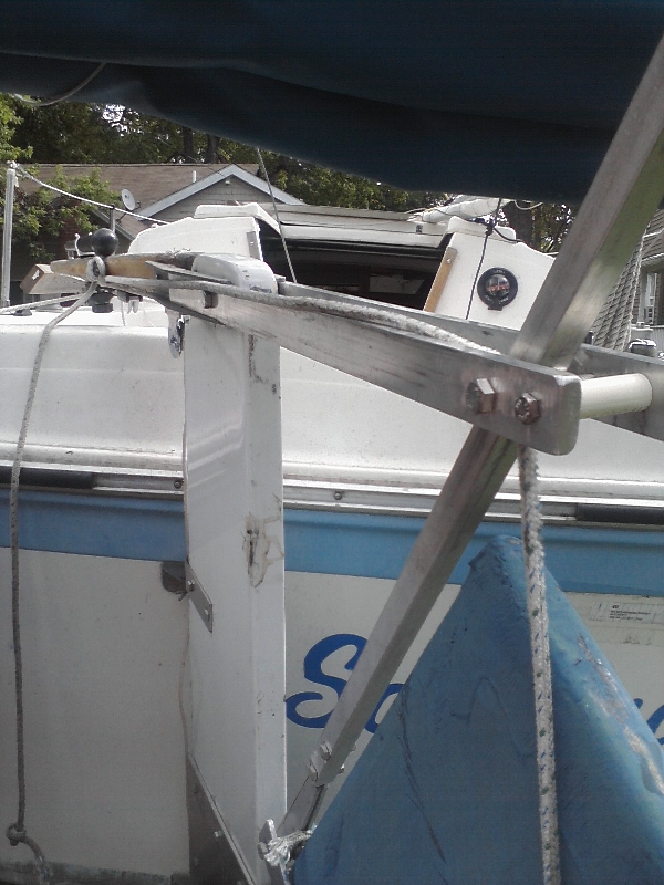 I added two pieces of aluminum 29&quot; long to each side of the tiller (extending 17&quot; aft of the rudder). They are ground to a very snug fit into the brackets holding the tiller to the rudder. A line runs from the push down rod bracket upwards between 2 bolts with PVC spacers at the end of the aluminum, forward to a small cleat on the tiller. To raise the rudder, simply lift the tiller handle, pull the line taught &amp; hold it over the cleat, push down tiller handle and the rudder pops right up. Also the system holds the rudder up while traveling.