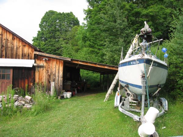 Initium with her &quot;boat shop&quot; in the background. The Admiral isn't convinced it's a boat shop.