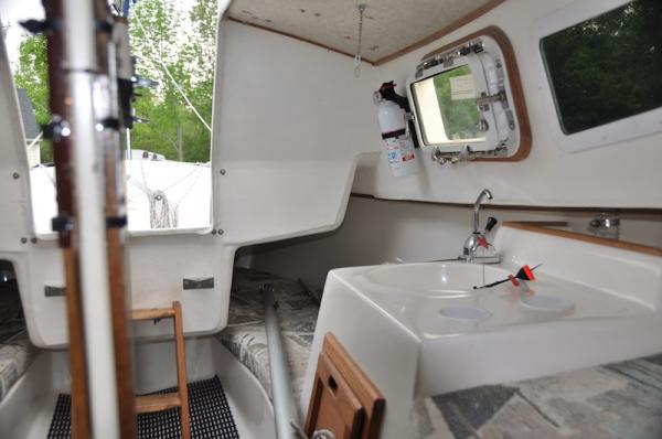 Inside cabin looking toward back berths or storage areas