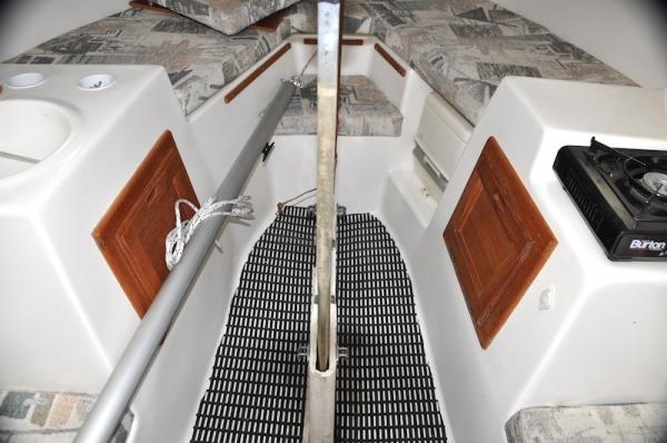 Inside cabin with keel up, sink on port and stove on starboard