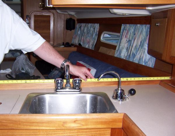 Installed fresh water pump on the galley sink.  Serves as backup should the 12V fresh water pump ever pack it in.