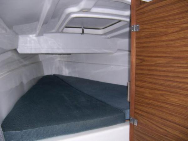 Interior forward view of double berth.....enclosed porta-pottie door just to starboard.