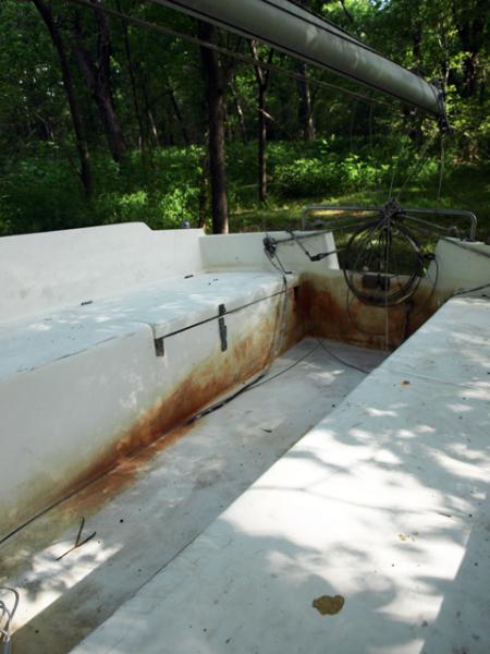 La Maestra Cockpit - Previous Owner had in a boat storage in San Antonio.  Evidently, the facility decided to set her back on the back of the trailer with bow in the air.  The cockpit filled up with water and sat, rusting fittings, and staining the cockpit.