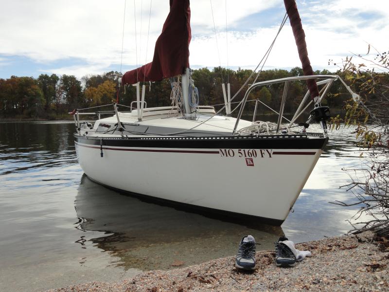 Lifting keel up, almost beached. Jumped off, stayed dry. Went hiking. (with the shoes)