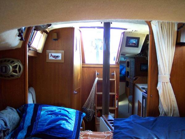 Looking aft from the v-berth in AQUILA. The door to the large head/shower/tub is starboard. You can see down the portside passage way past the galley, nav station and into the aft cabin.