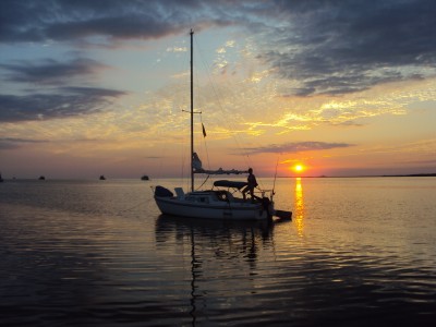 Loose Diamond at anchor, sunset day 1 (boat babe/wife in pic).