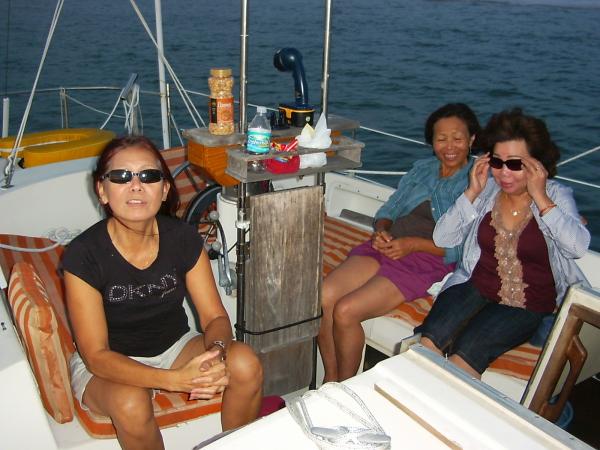 Mai, left and 2 family friends on LeahNicole on the intercoastal near Indian Rocks Beach, Fl.  6/09