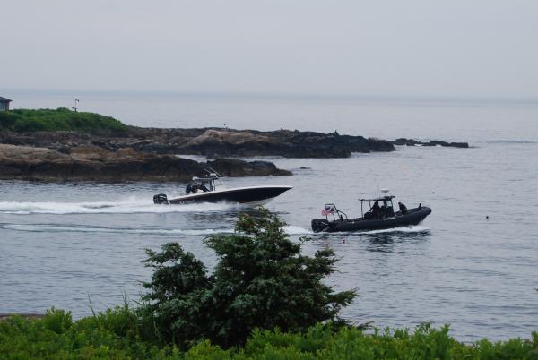 Me on-duty with FP Bush in Kennebunkport, ME. on our USSS boat, alongside his boat, Fidelity IV