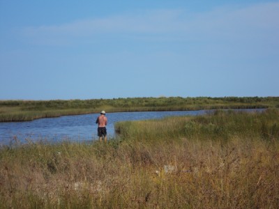 Me throwing cast net in inland pond, Cat Island, MS