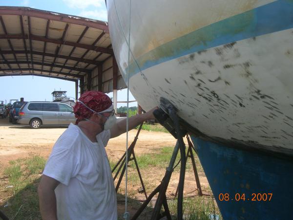 Mike M. sanding the bottom in preparation for blister repair during our exterior overhaul (summer 2008)