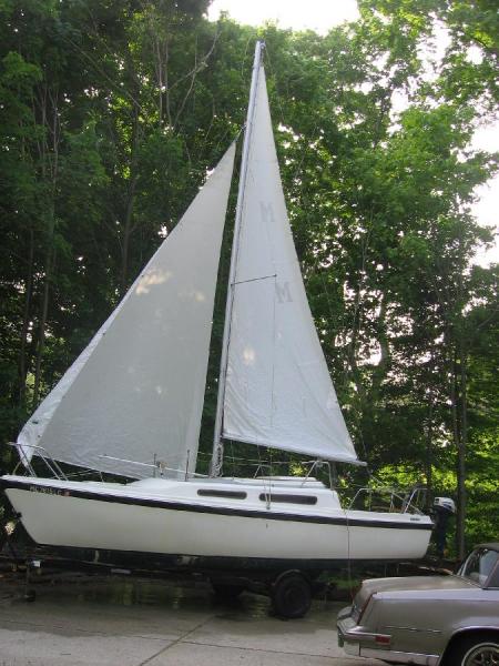 My current boat, 1981 Macgregor 25, in the driveway of the guy where I bought her.  She was sailed in Lake Michigan.