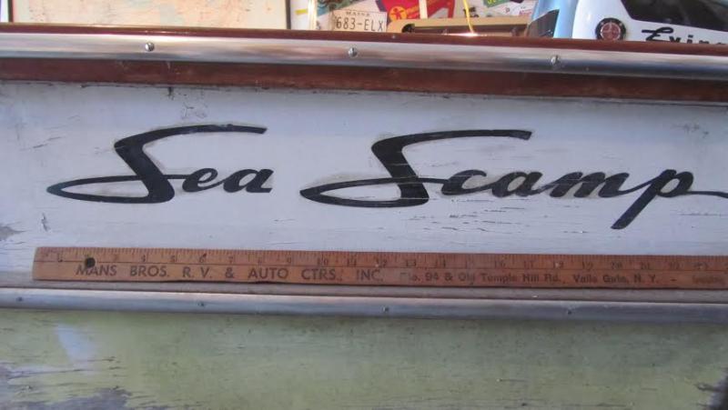 My dad designed the Sea Scamp logo; this boat has an original 1957 machined-plastic logo badge, itself worth a small fortune for its provenance.  I wanted to just see and touch this; but the owner had left it off when he delivered the boat for work and reinstalled it only after he had repainted the boat at home.