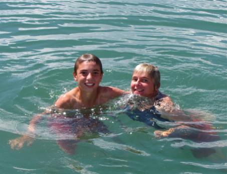 My daughter Laura and grandson Teak swimming off the bow of Paradox